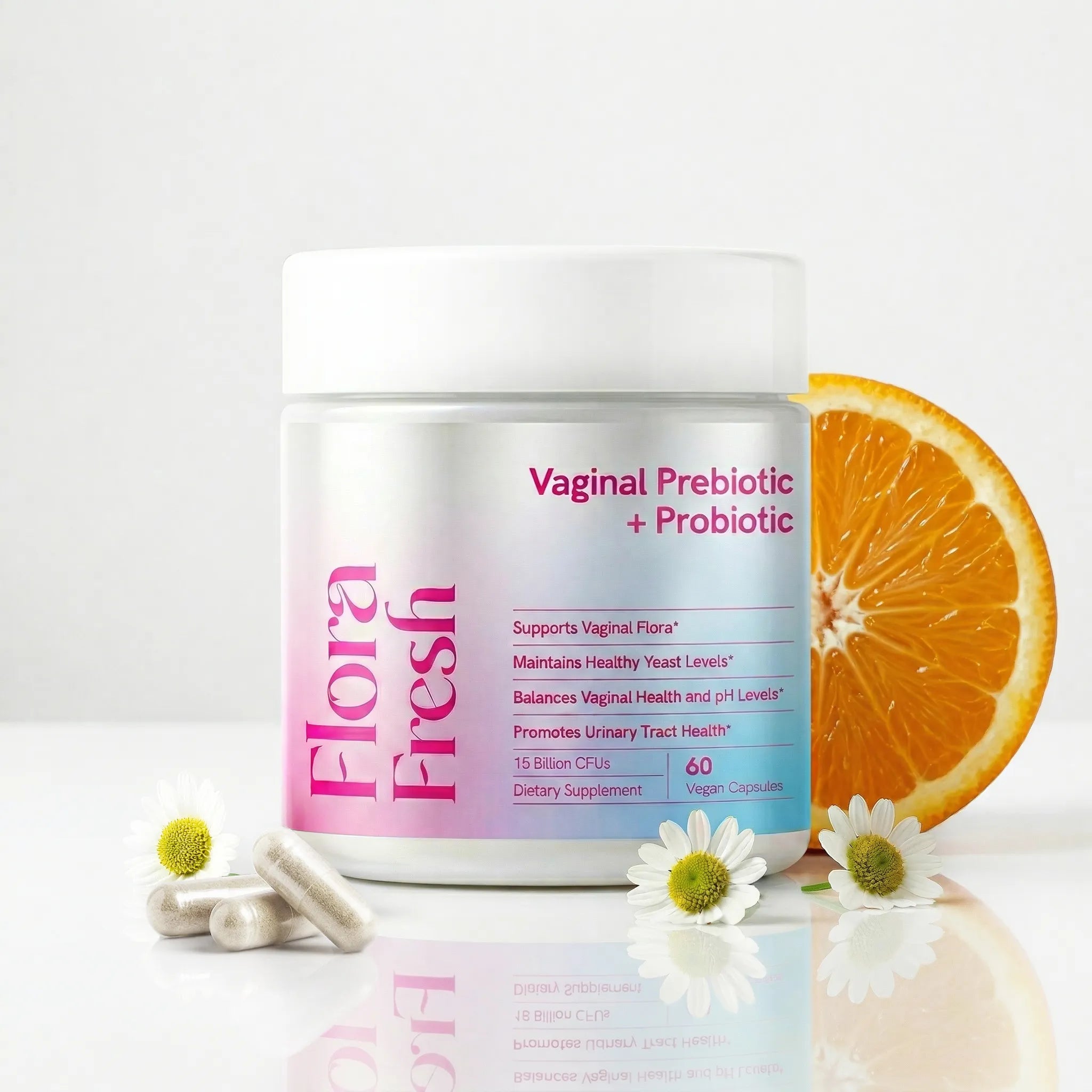Flora Fresh Vaginal Prebiotic + Probiotic supplement jar with an orange slice and flowers on a white background